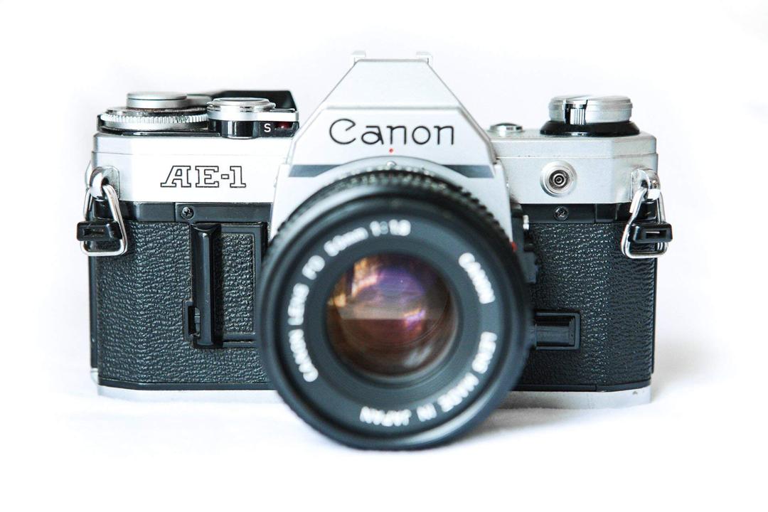 Vintage Canon AE-1 35mm SLR Camera with 50mm 1:1.8 Lens (Renewed)