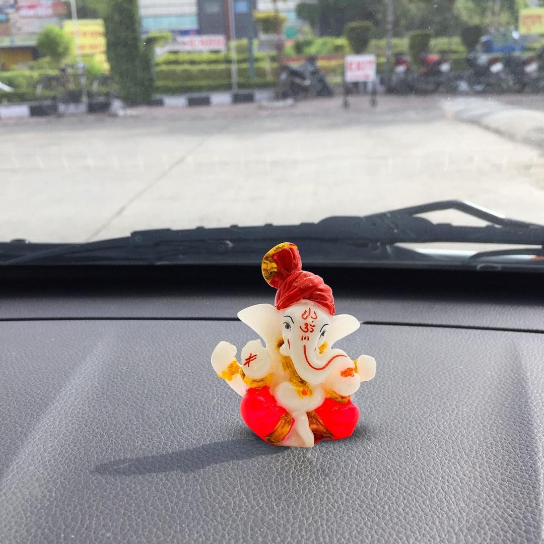 Rare Planet Lord Ganesh Idol Polystone Handpainted for Showpiece/Car Dashboard | Murti Items for Home/Festival Decors | Well Finished Gifts - Size :- 5.5 Cm X 6.2 Cm X 2 Cm, Orangish Dhoti-Red Paggad